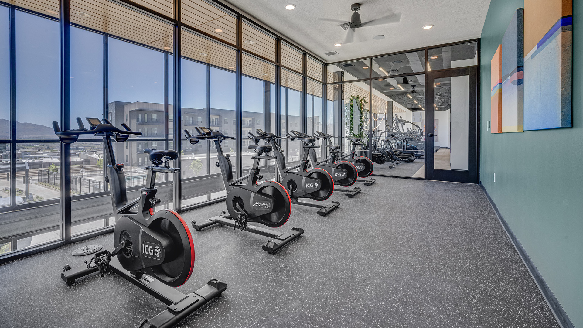 Gym view with cycling equipment.